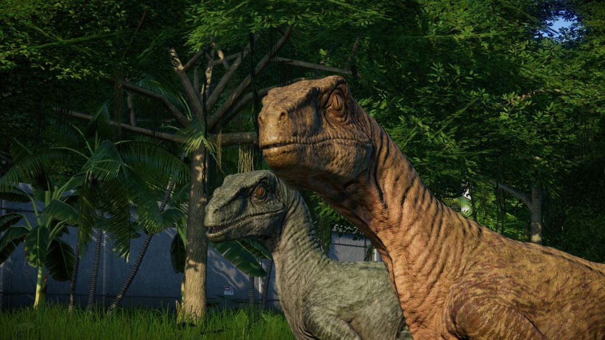 t rex and velociraptor jurassic world evolution