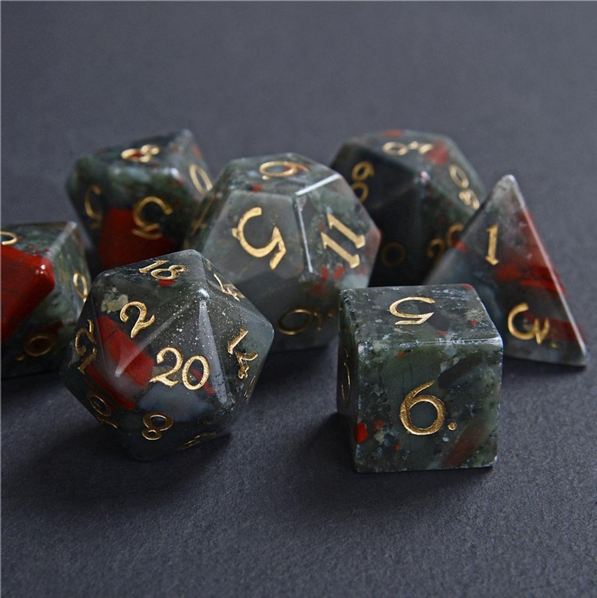 These dice are a mixture of grey, grey-green, and red and have gold numbers.