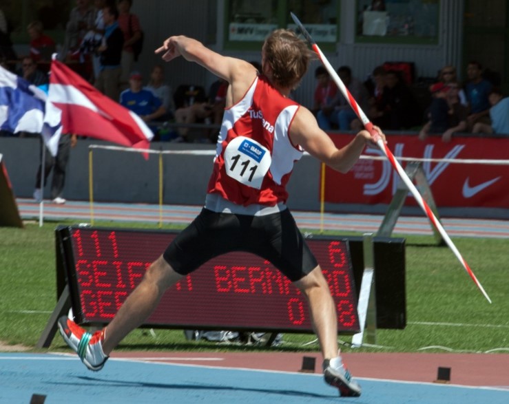 An Olympic athlete throwing a javelin.