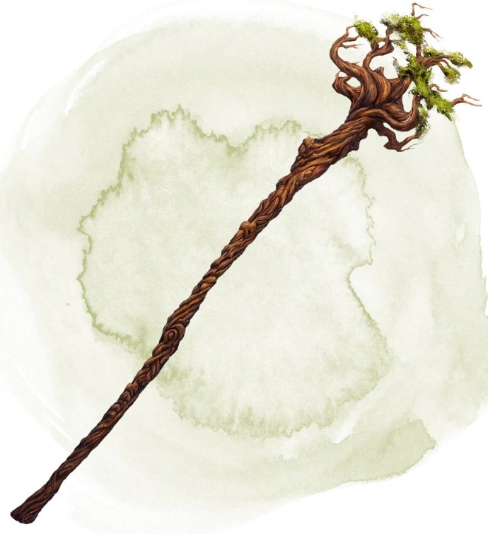 A staff of wood topped with a little moss