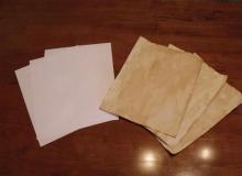Use props like yellowed paper or burning your paper at the corners to create realistic handouts for your players.