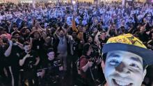 Axe taking a photo with a crowd