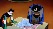 Batman figuring out details with Robin