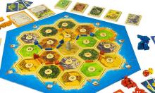 Play area and pieces for the original Catan game.