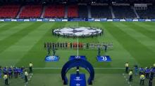 Teams walk out to start a champions league match