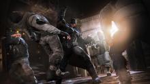 Batman fighting some camo-dressed thugs in Batman: Arkham Origins 