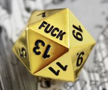 A golden D20 with the F word written where the 1 should be. 