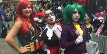 DC villain cosplayers, representing Poison Ivy, Harley Quinn, and the Joker from Batman