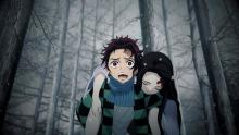 Tanjirou carries his sister Nezuko, who has been turned into a demon.