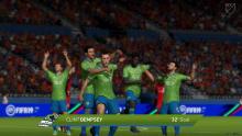 Clint Dempsey scores for the Seattle Sounders and celebrates with the team