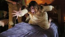Jennifer Carpenter lunges off bed.