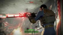 Fallout 4 character brandishes a gun at a raifer