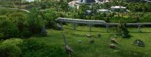 A herbivore enclosure with Jurassic World's monorail passing over the plant-eating dinos.