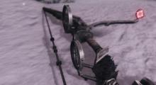 Close up shot of a precision bow with a sight for assisted aim.
