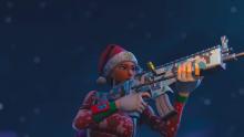 The ever-so-festive Nog Ops aims her AR, with a snowy backdrop.