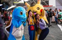 Pokemon cosplayers and two Pokemon fans