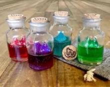 Use Epoxy in tiny glass bottles you can grab from a thrift shop to make physical representations of the magical beverages your players may acquire.