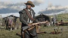 A Bounty Hunter stands watch while his posse rests at camp.