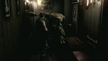 A hunter jumps out to assault Chris Redfield in Resident Evil HD Remaster