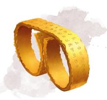 Gold two-finger ring with symbols marked into the metal