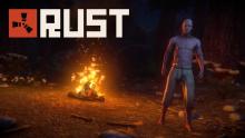 A half-naked player stands next to a campfire at night.