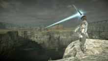 Wanderer gathering light with sword: Shadow of the Colossus