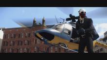 The player will have to throw the bag of money that is currently slung over their shoulder onto the helicopter as it hovers nearby.