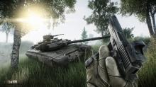 The player POV of a pistol-wielding PMC coming across a large tank